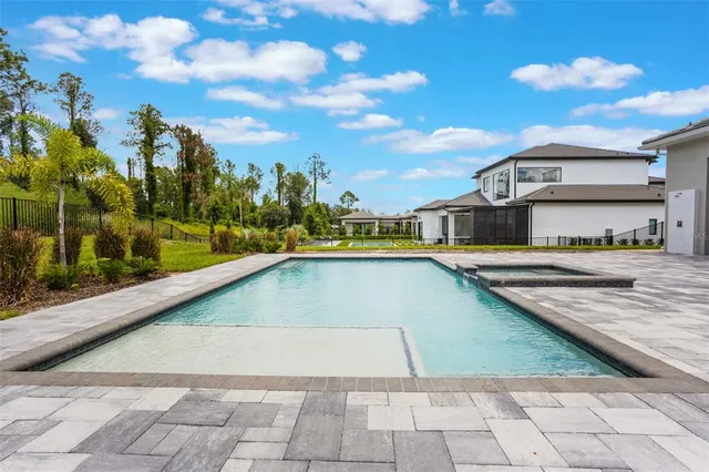 a view of a swimming pool with a lounge chairs