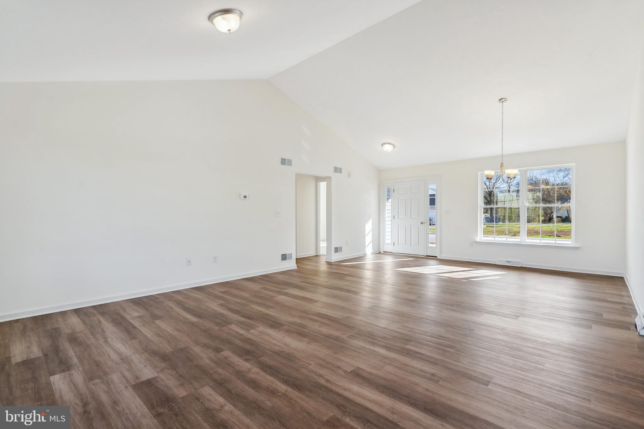 87 Eagle Lane Hanover, PA 17331 - Photo 3 of 16 an empty room with wooden floor and windows