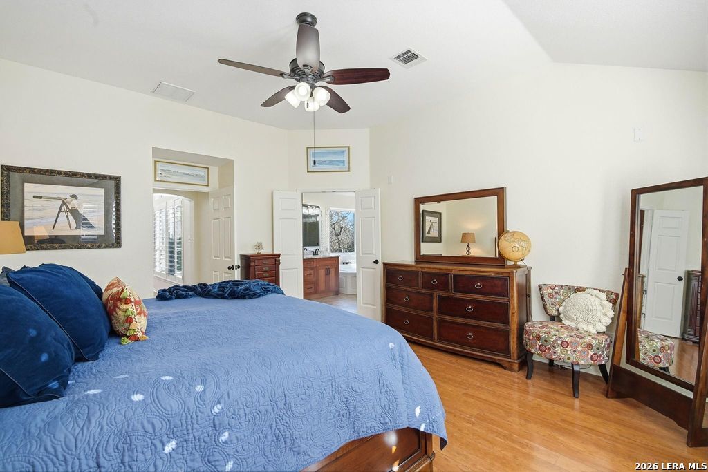 318 River Ridge Boerne, TX 78006 - Photo 19 of 46 a bed room with a bed and a dresser
