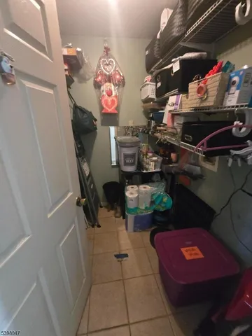 a bathroom with a sink toilet and window