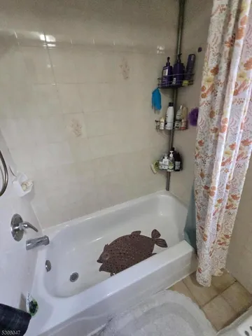 a kitchen with a sink a stove a microwave and cabinets