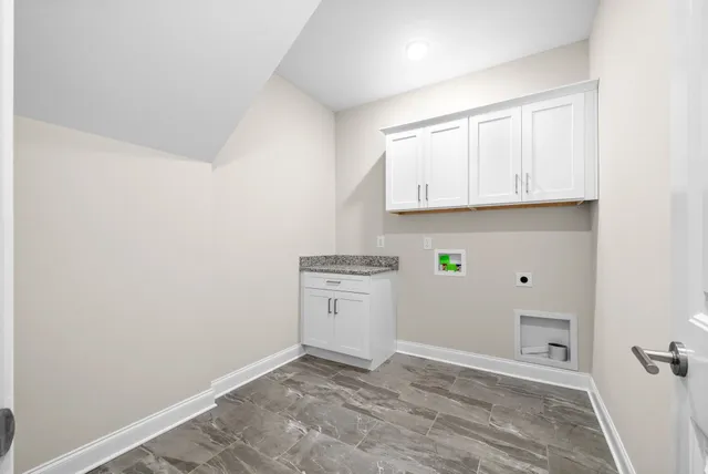 a view of a kitchen with cabinets