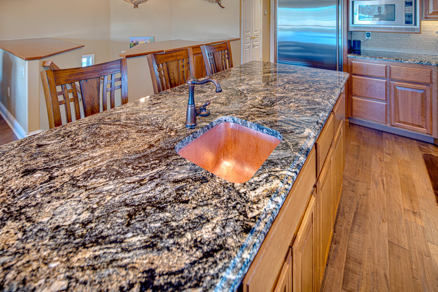 66250 Gerking Market Road Bend, OR 97703 - Photo 23 of 86 Newer granite counters, copper farm house sink, prep sink and faucets in kitchen