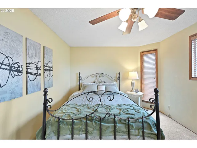 a view of a dining room with furniture and a chandelier
