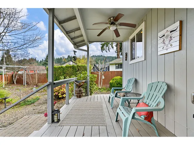 a view of a chairs and table in the balcony