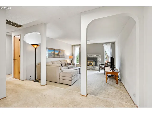 a living room with furniture and a table