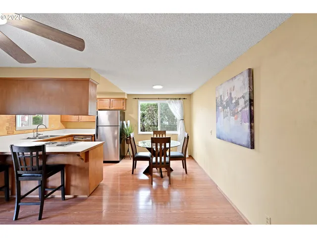 a dining room with a table and chairs
