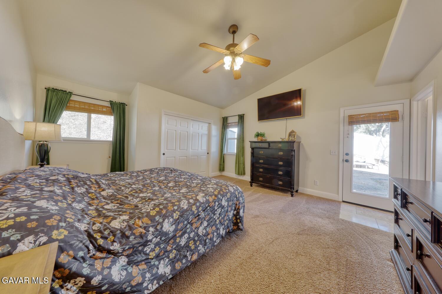 22311 Zurich Drive Tehachapi, CA 93561 - Photo 12 of 37 a bedroom with a bed and a television