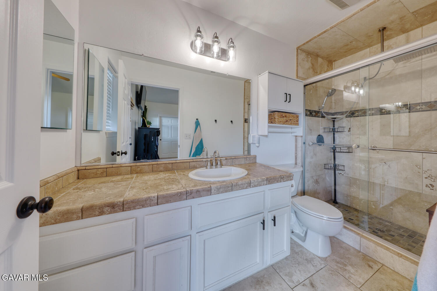 22311 Zurich Drive Tehachapi, CA 93561 - Photo 15 of 37 a bathroom with a granite countertop sink toilet and shower