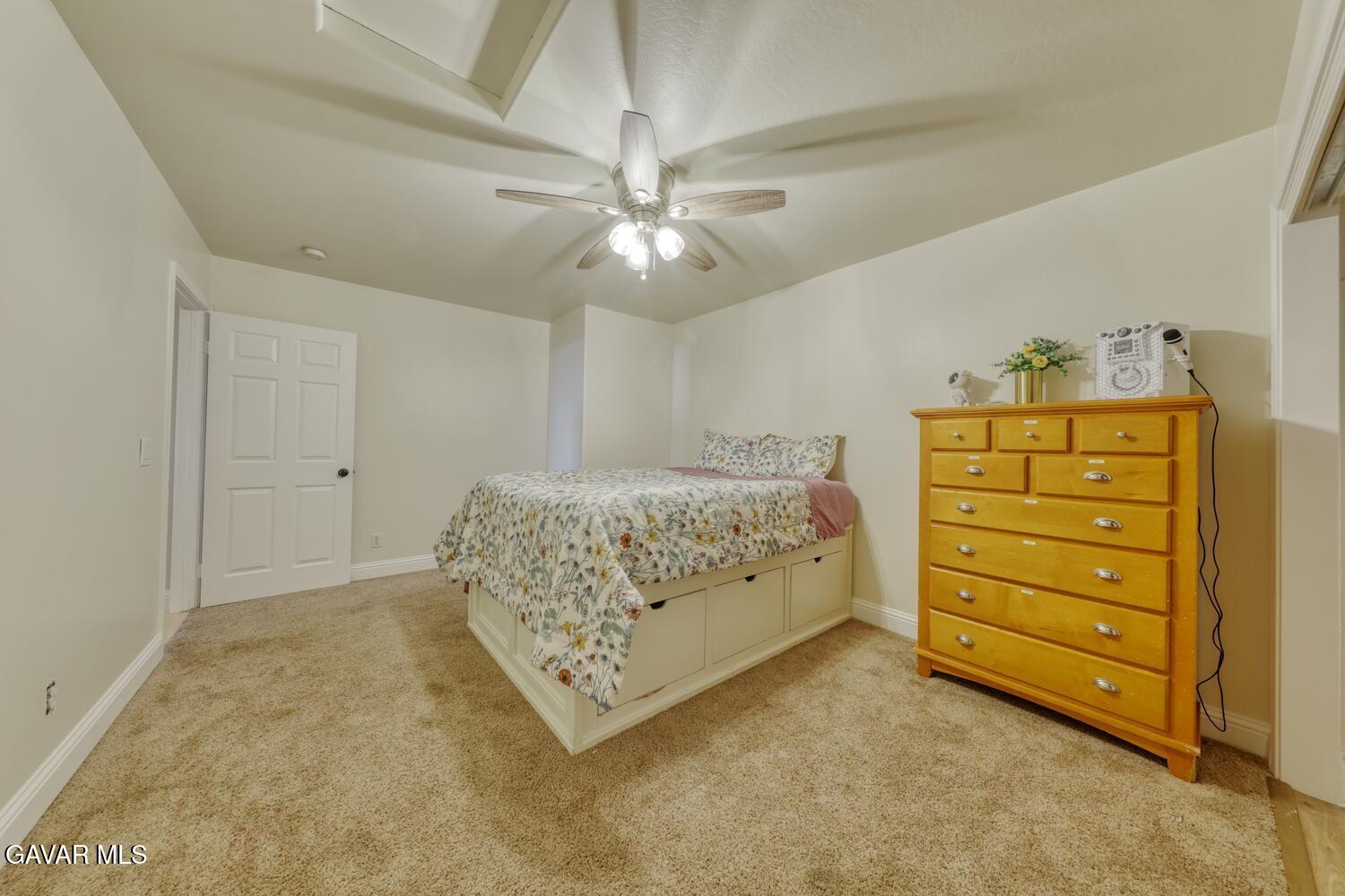 22311 Zurich Drive Tehachapi, CA 93561 - Photo 20 of 37 a bedroom with a bed and a ceiling fan
