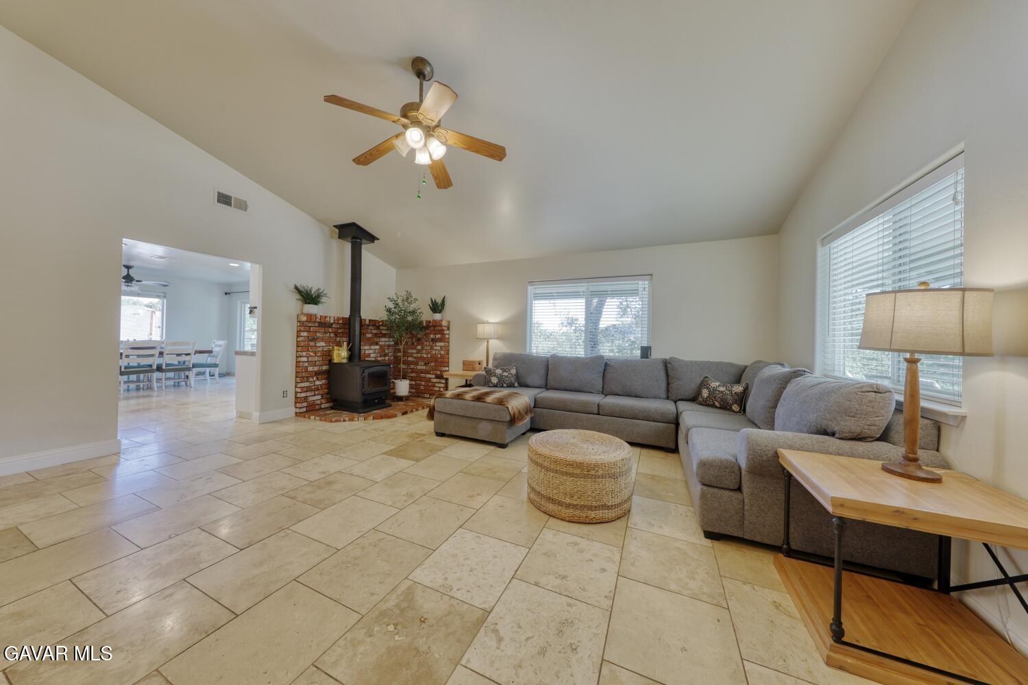 22311 Zurich Drive Tehachapi, CA 93561 - Photo 2 of 37 a living room with furniture and a chandelier
