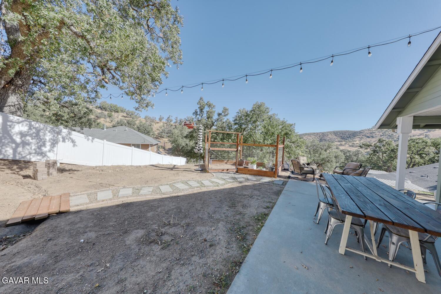 22311 Zurich Drive Tehachapi, CA 93561 - Photo 23 of 37 a view of a patio with a yard