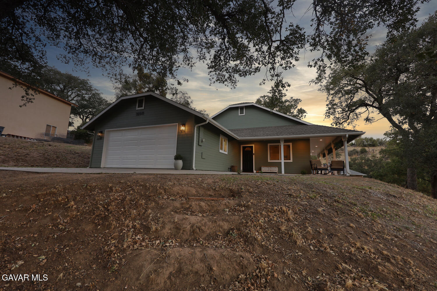 22311 Zurich Drive Tehachapi, CA 93561 - Photo 31 of 37 a front view of a house with a yard and garage