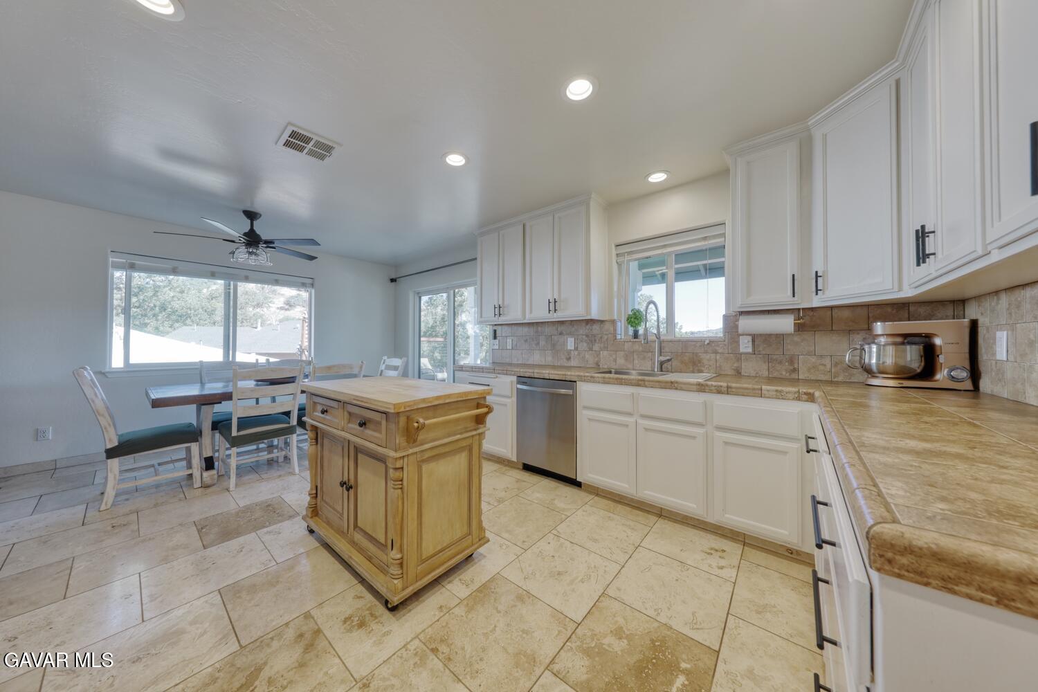 22311 Zurich Drive Tehachapi, CA 93561 - Photo 8 of 37 a kitchen that has a lot of cabinets in it and appliances