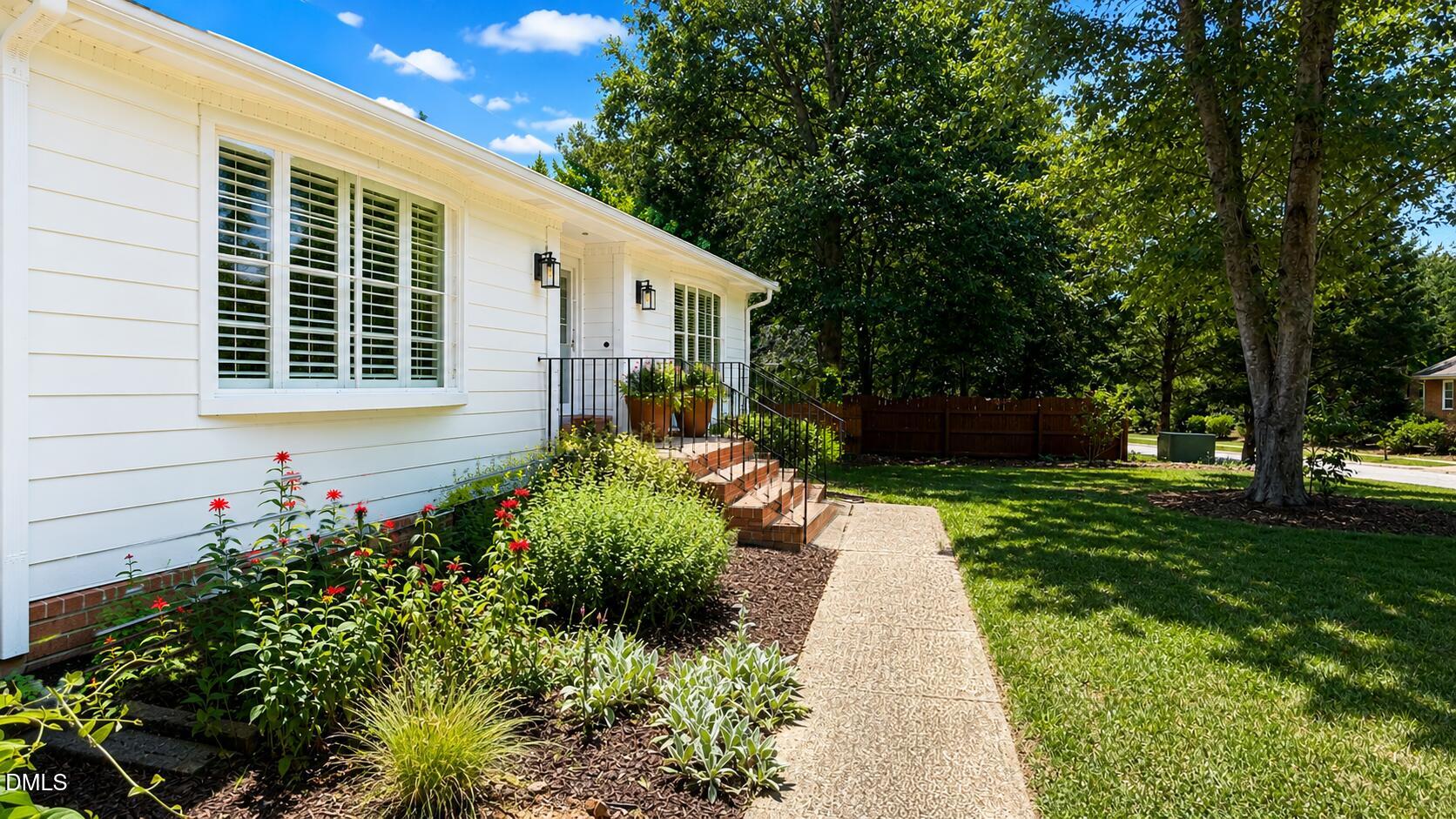 5904 Volant Drive Raleigh, NC 27609 - Photo 5 of 42 a front view of a house with garden