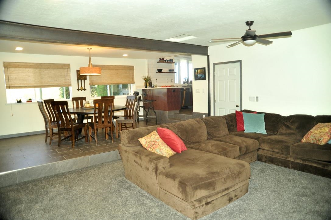 445 35 Road Palisade, CO 81526 - Photo 14 of 42 a living room with furniture kitchen view and a large window