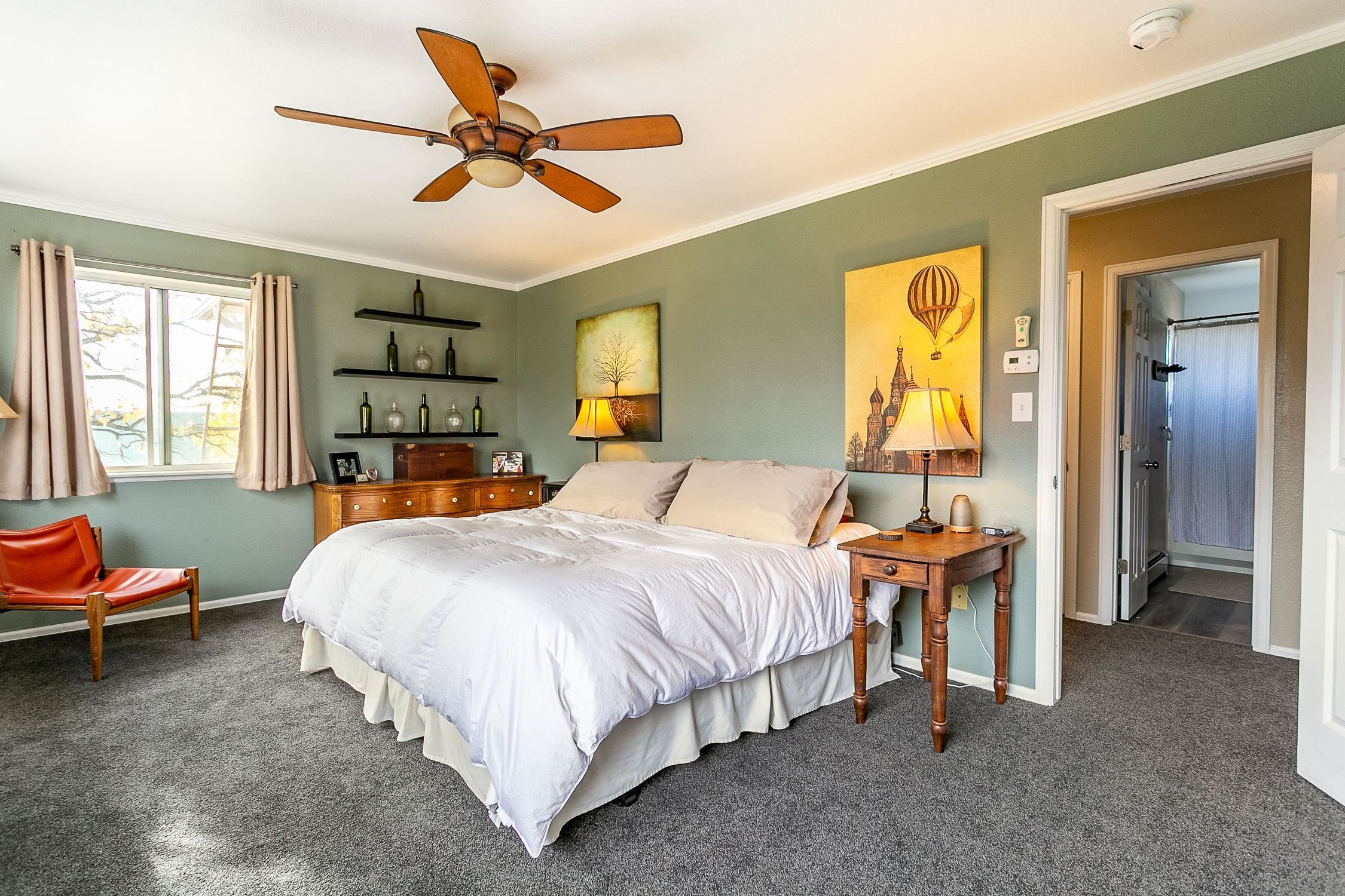 445 35 Road Palisade, CO 81526 - Photo 19 of 42 a bedroom with a bed and wooden floor