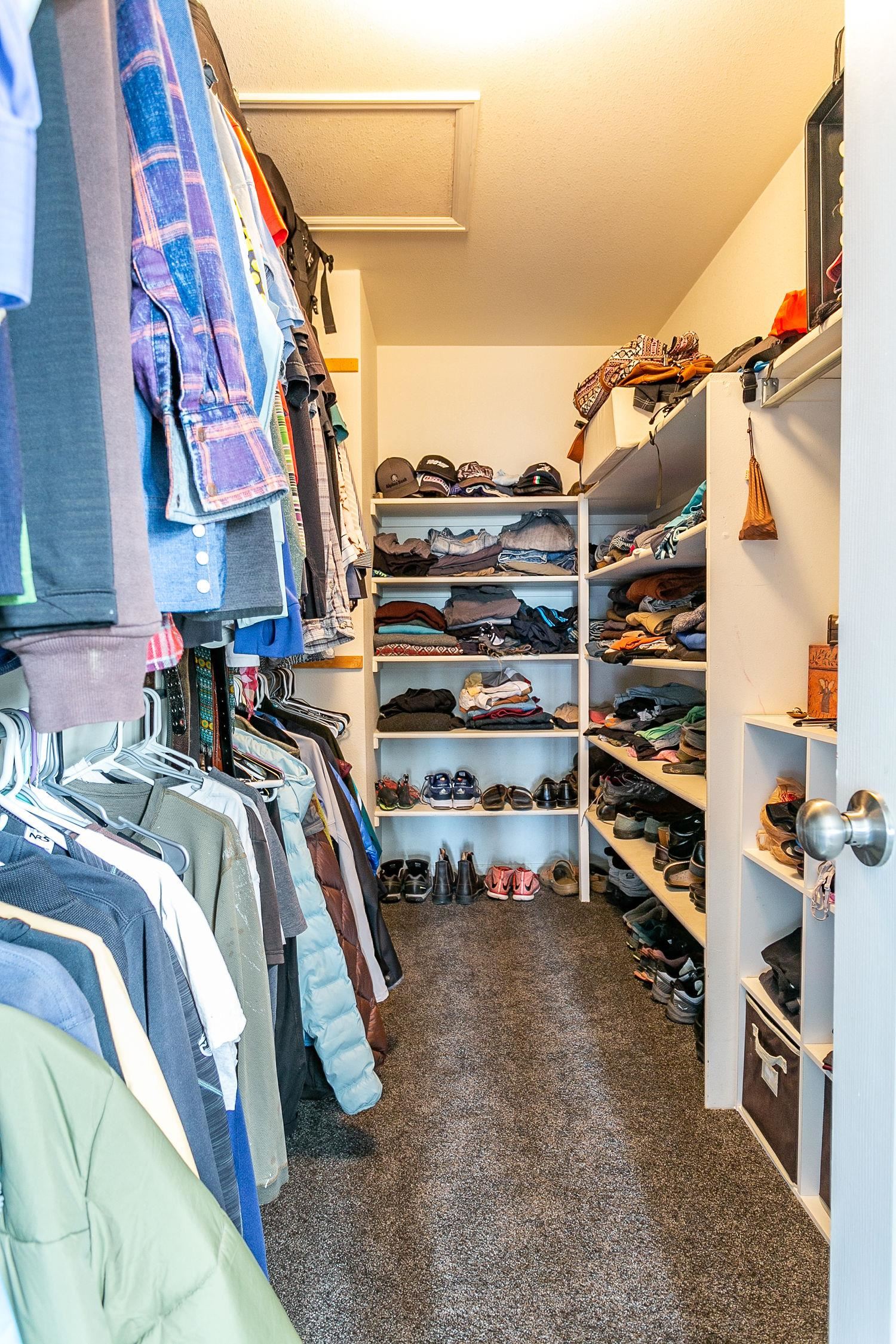 445 35 Road Palisade, CO 81526 - Photo 21 of 42 a view of walk in closet with clothes and shoes
