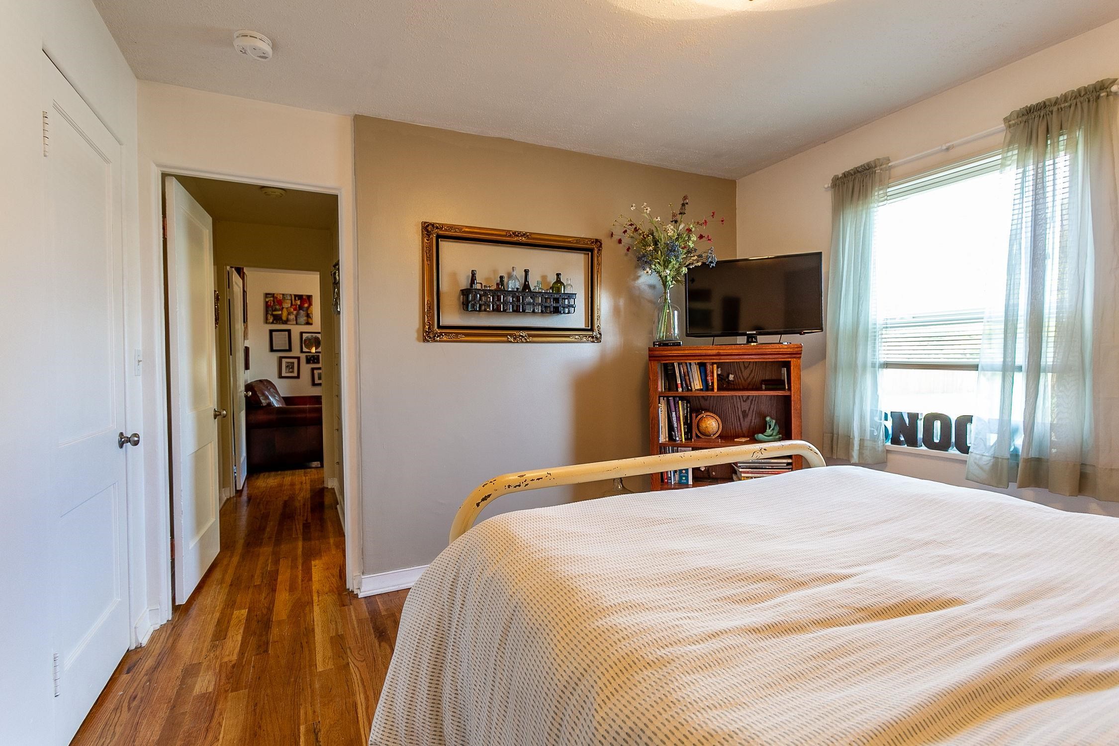 445 35 Road Palisade, CO 81526 - Photo 23 of 42 a bedroom with a bed and a flat screen tv