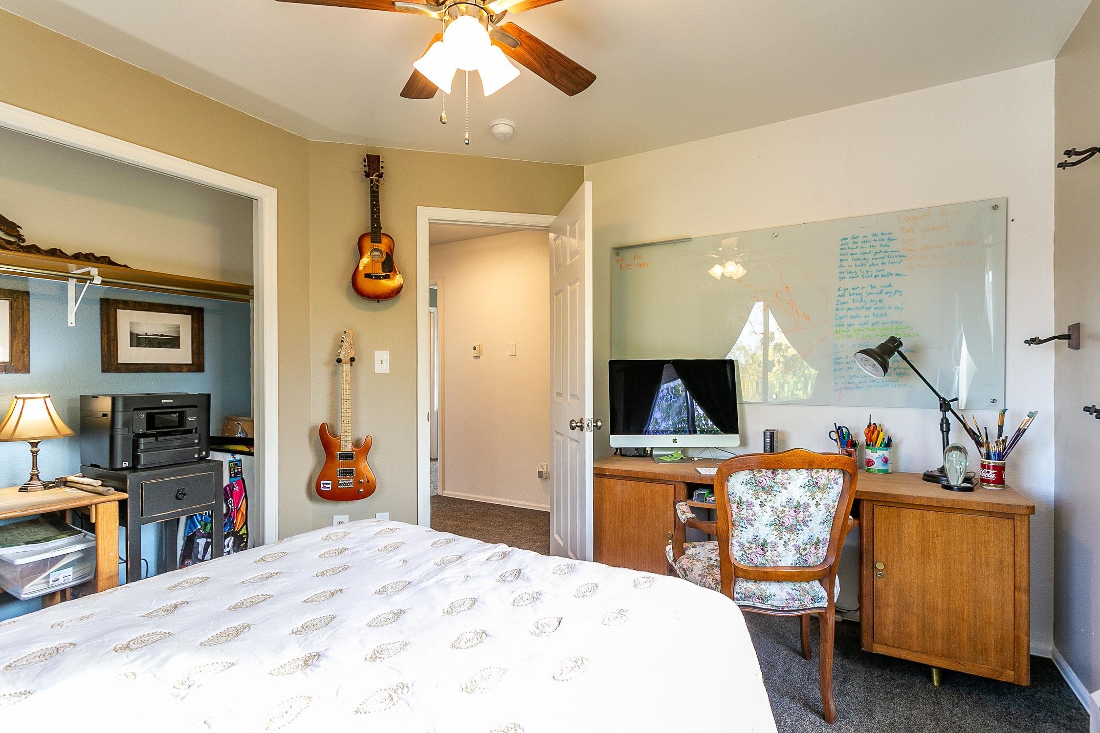 445 35 Road Palisade, CO 81526 - Photo 25 of 42 a bed room with a bed and a television