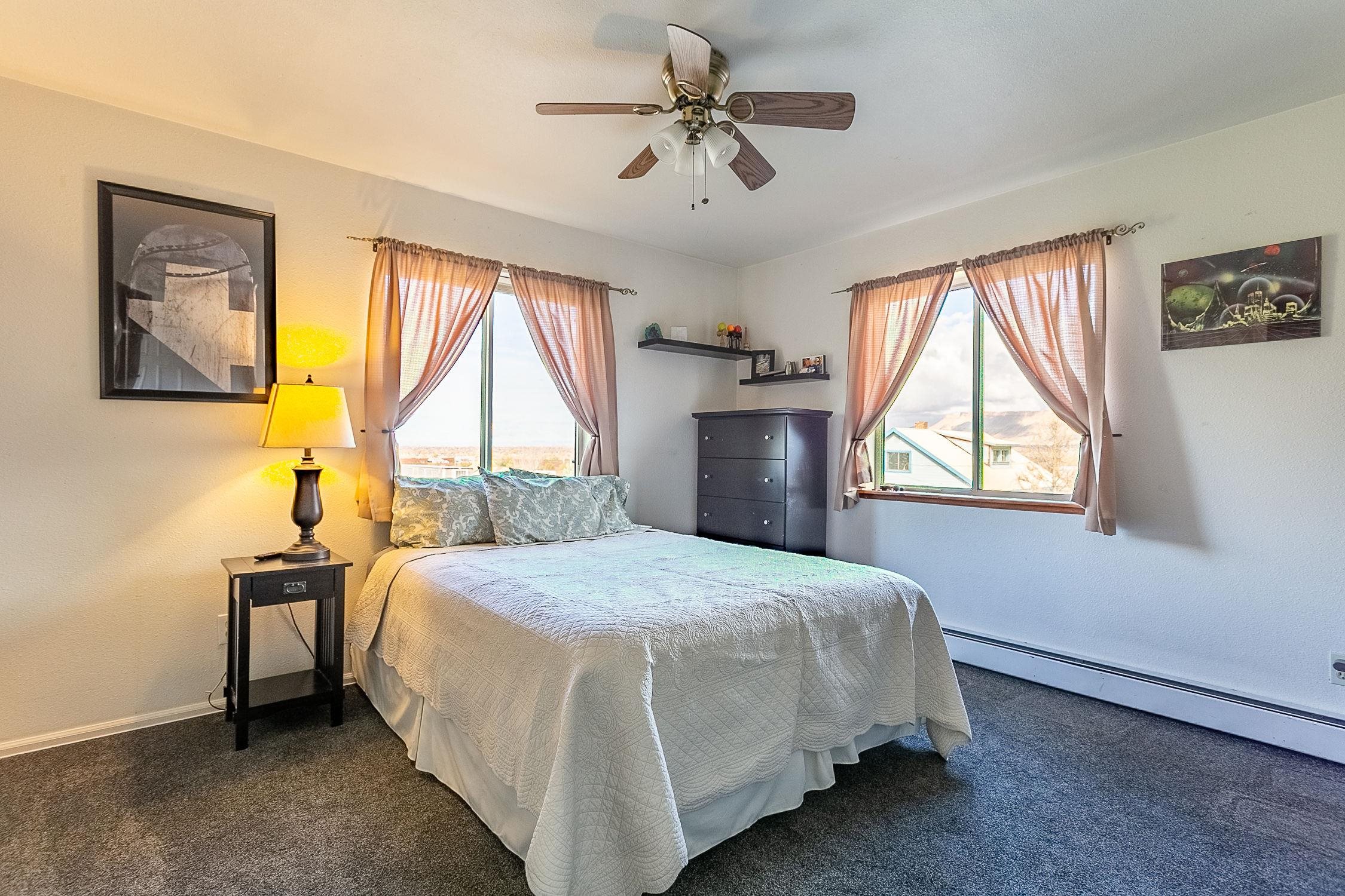 445 35 Road Palisade, CO 81526 - Photo 26 of 42 a bedroom with a bed and a window