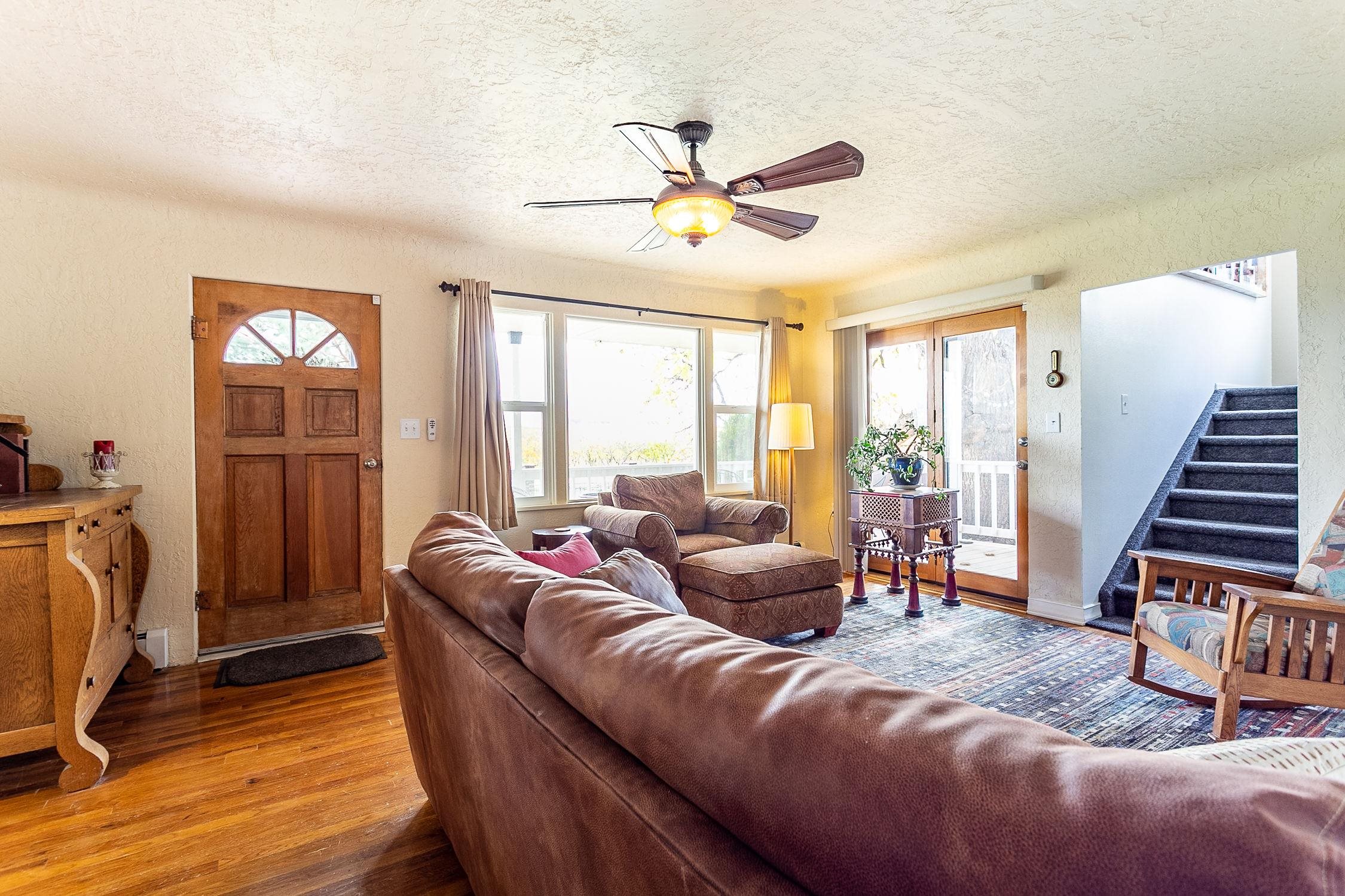 445 35 Road Palisade, CO 81526 - Photo 5 of 42 a living room with furniture and a chandelier