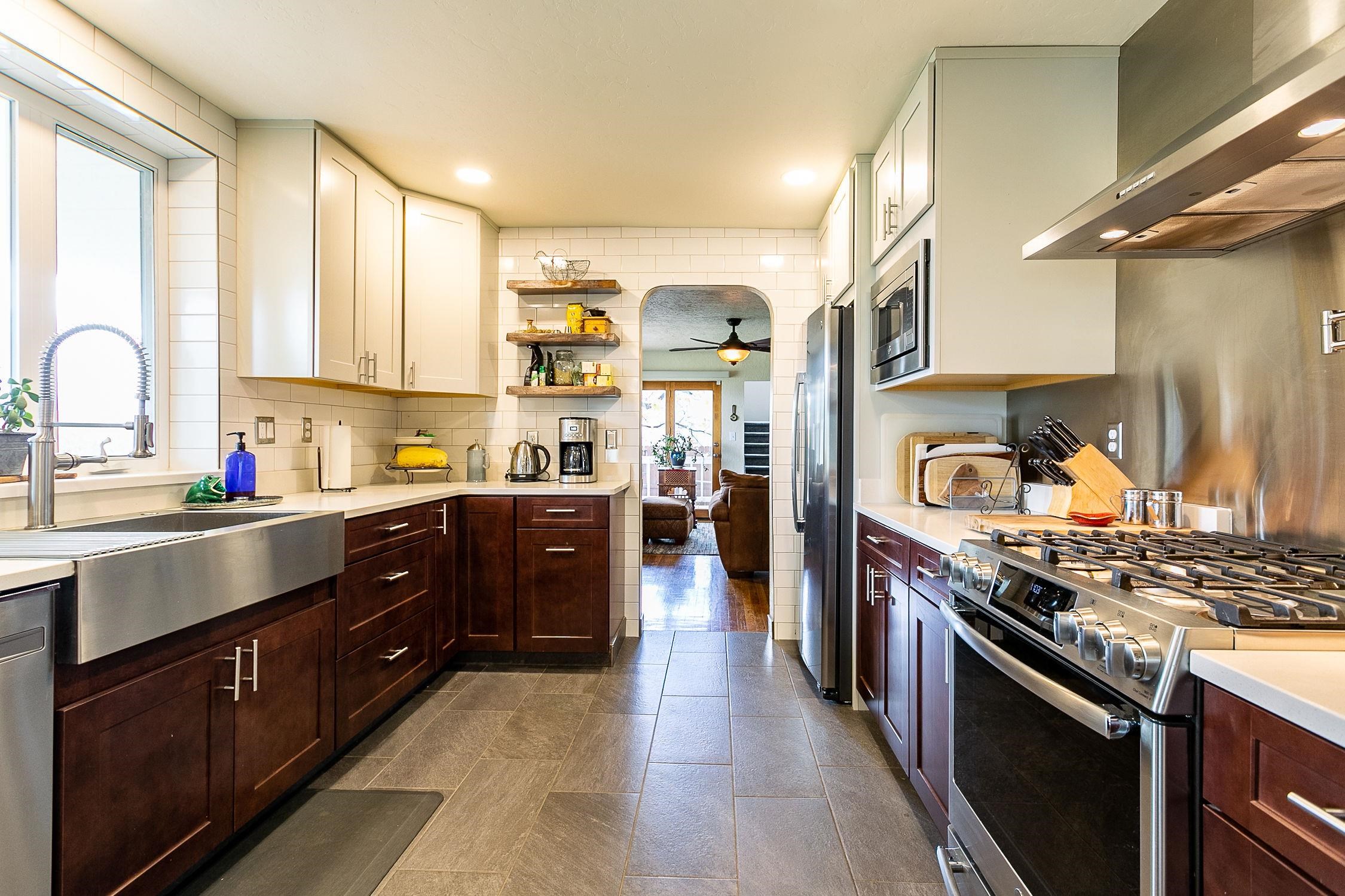 445 35 Road Palisade, CO 81526 - Photo 7 of 42 a kitchen with stainless steel appliances granite countertop a stove a sink dishwasher and a refrigerator