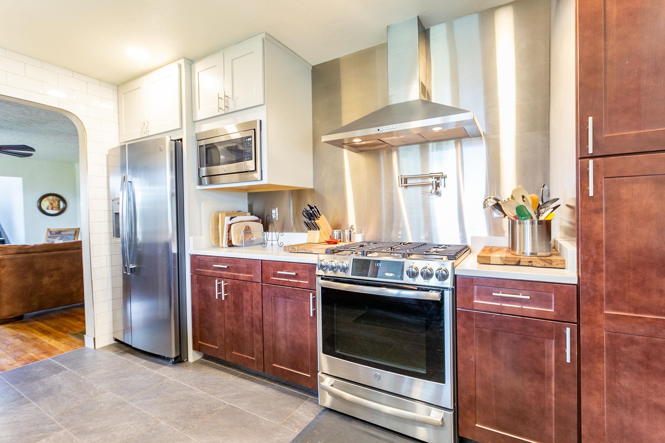 445 35 Road Palisade, CO 81526 - Photo 10 of 42 a kitchen with stainless steel appliances granite countertop a stove and a refrigerator