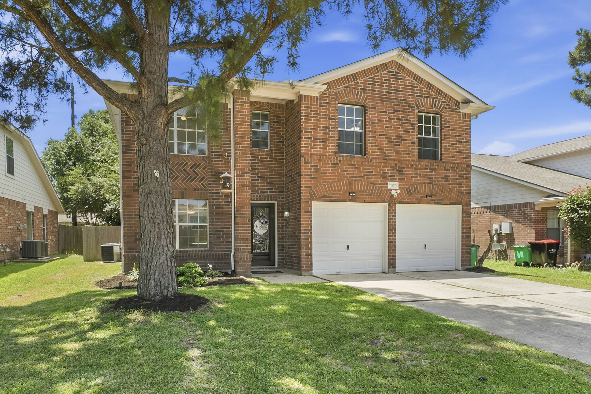 11907 Ezekiel Road Tomball, TX 77375 - Photo 2 of 39 front view of house with a yard