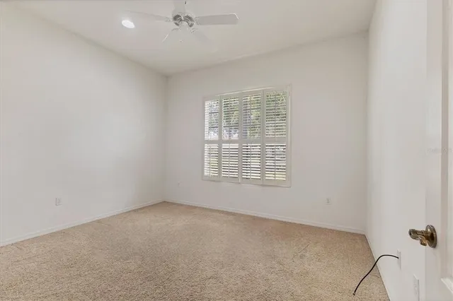 an empty room with a empty space and windows