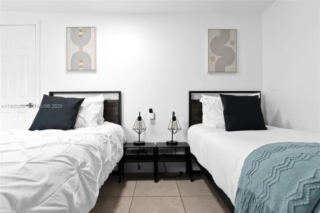 a bedroom with bed and cupboard