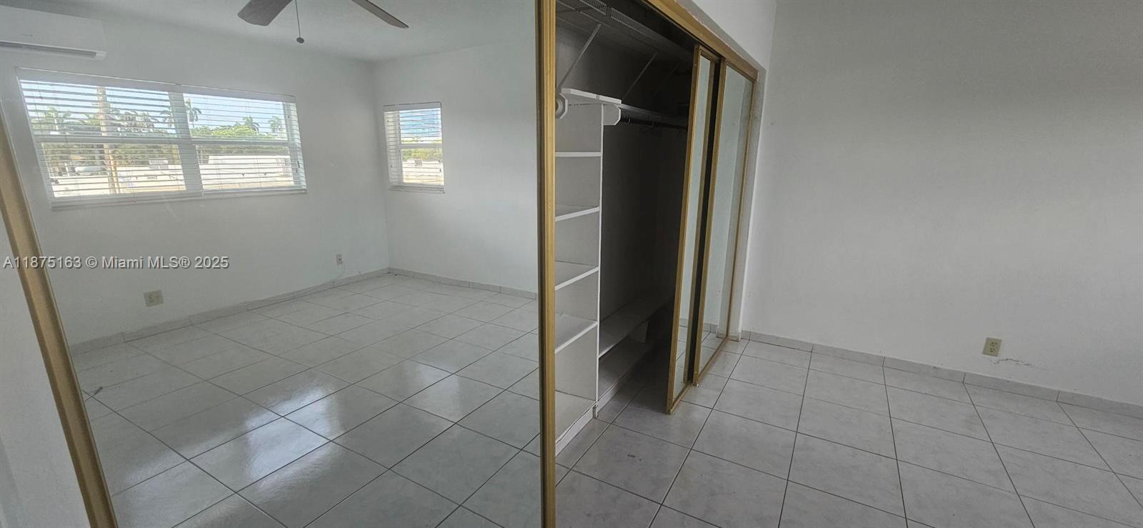 141 Northeast 10th Avenue, Unit 22C Hallandale Beach, FL 33009 - Photo 16 of 16 an empty room with windows