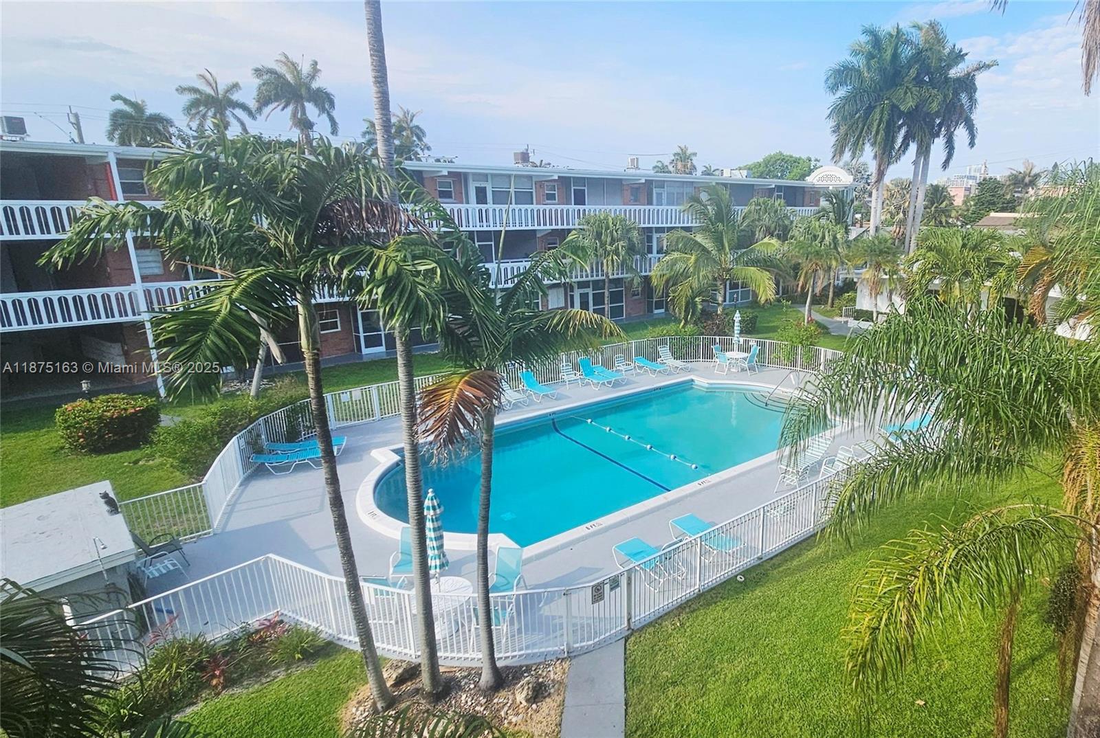 141 Northeast 10th Avenue, Unit 22C Hallandale Beach, FL 33009 - Photo 2 of 16 a view of a garden and basketball court