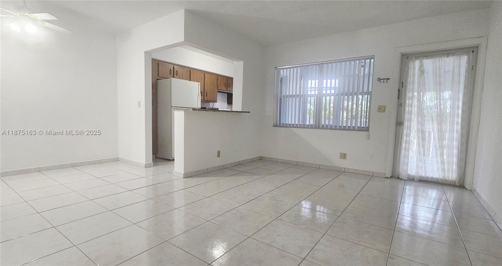 141 Northeast 10th Avenue, Unit 22C Hallandale Beach, FL 33009 - Photo 9 of 16 a view of an empty room with a window