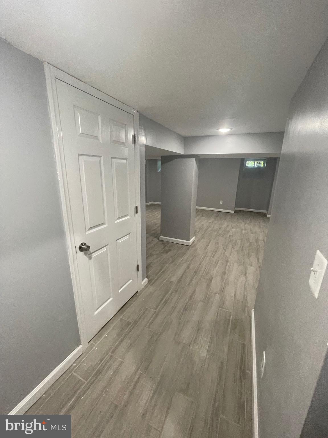 6416 Overbrook Avenue Philadelphia, PA 19151 - Photo 11 of 18 a view of a hallway with wooden floor