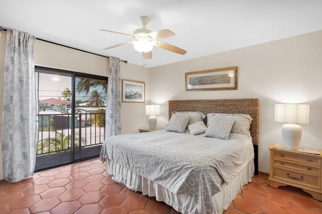 a bedroom with a large bed and a tv