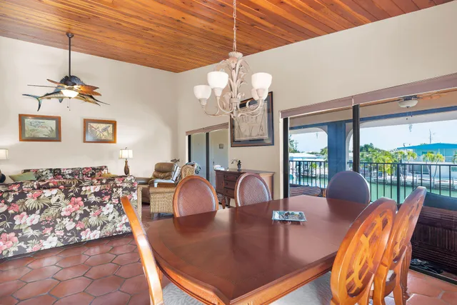 a living room with furniture and a lamp