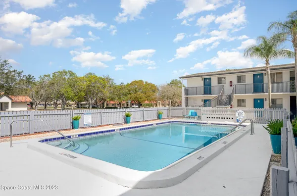 a view of a swimming pool with a patio