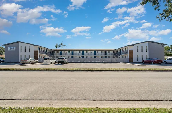 a view of swimming pool with outdoor seating and yard in the back