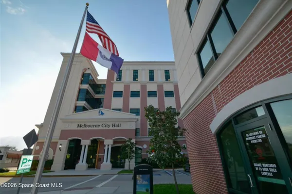 a view of a building with a yard