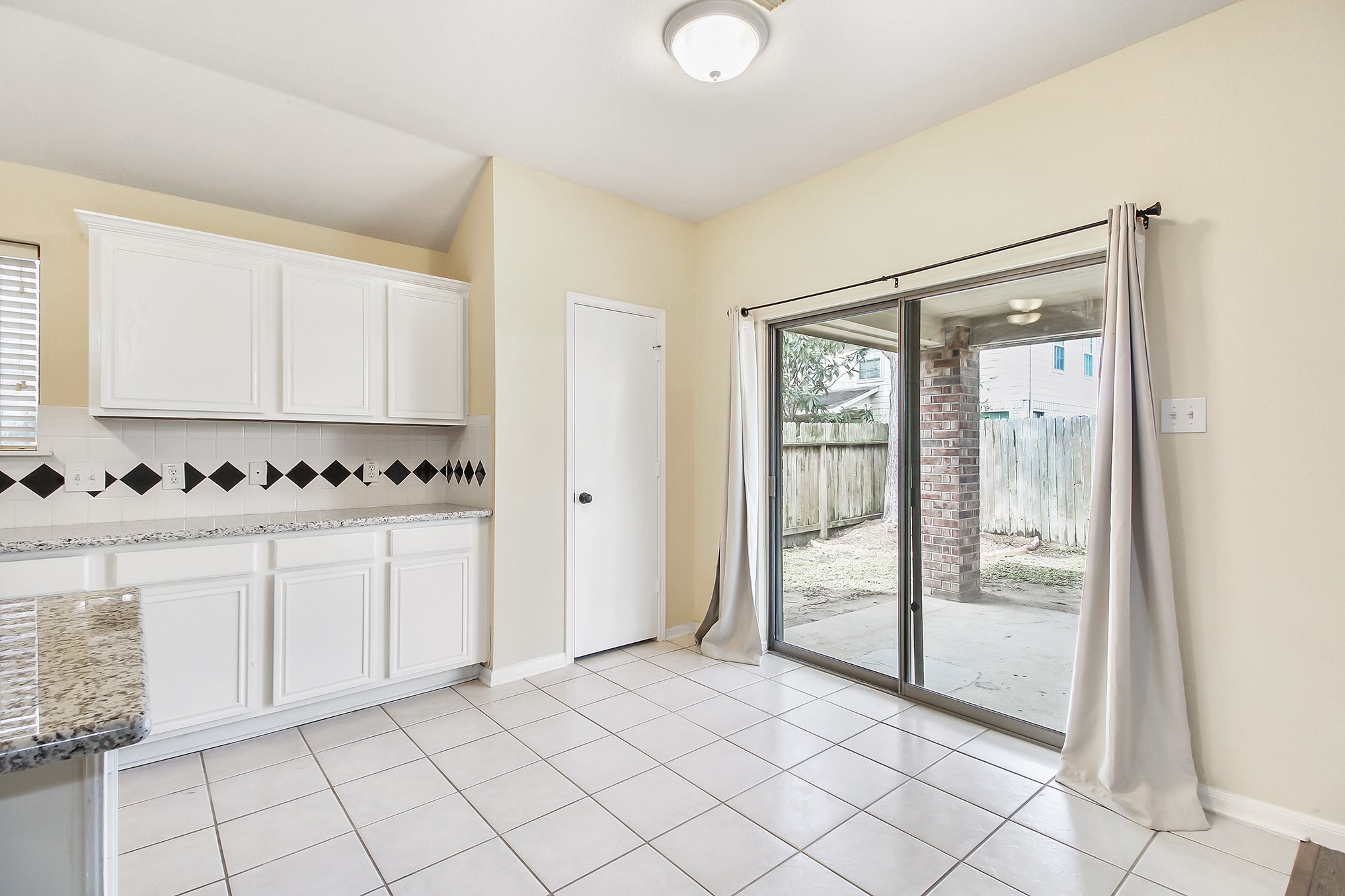 1814 Parkfair Court Katy, TX 77450 - Photo 18 of 36 Breakfast area has views of the backyard. The large pantry with shelving is conveniently located.