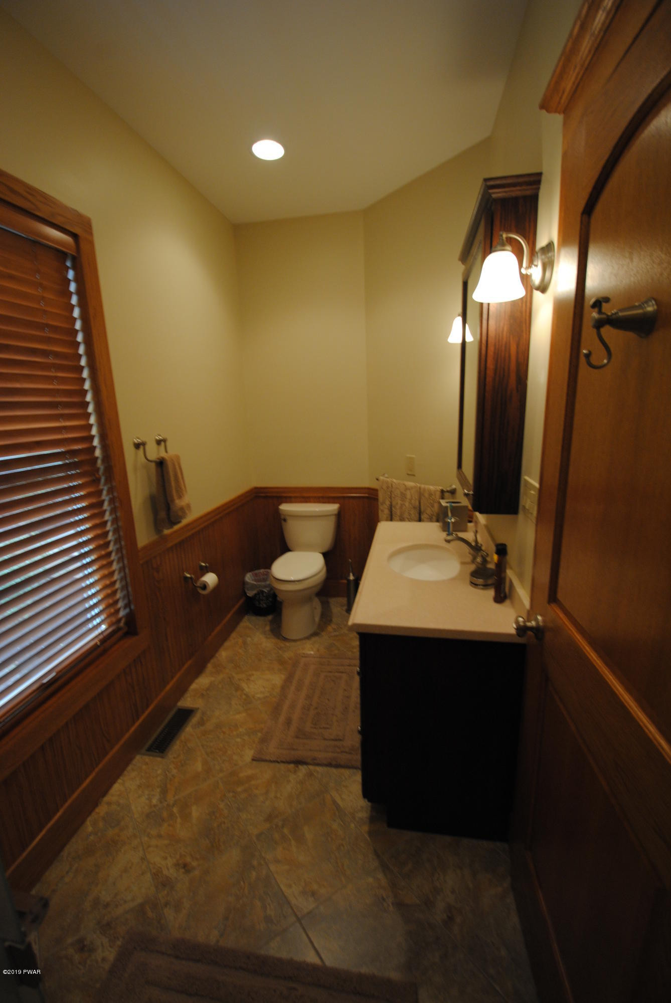 419 Bare Valley Road Montrose, PA 18801 - Photo 31 of 72 a bathroom with a sink and mirror