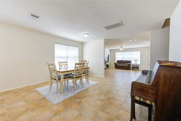 a dining room with furniture and a table