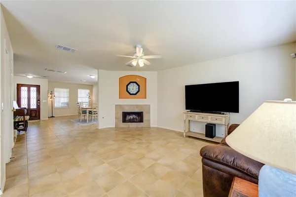 a view of a livingroom with furniture and a flat screen tv