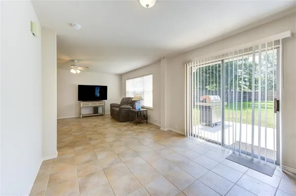 a view of livingroom with furniture and floor to ceiling window