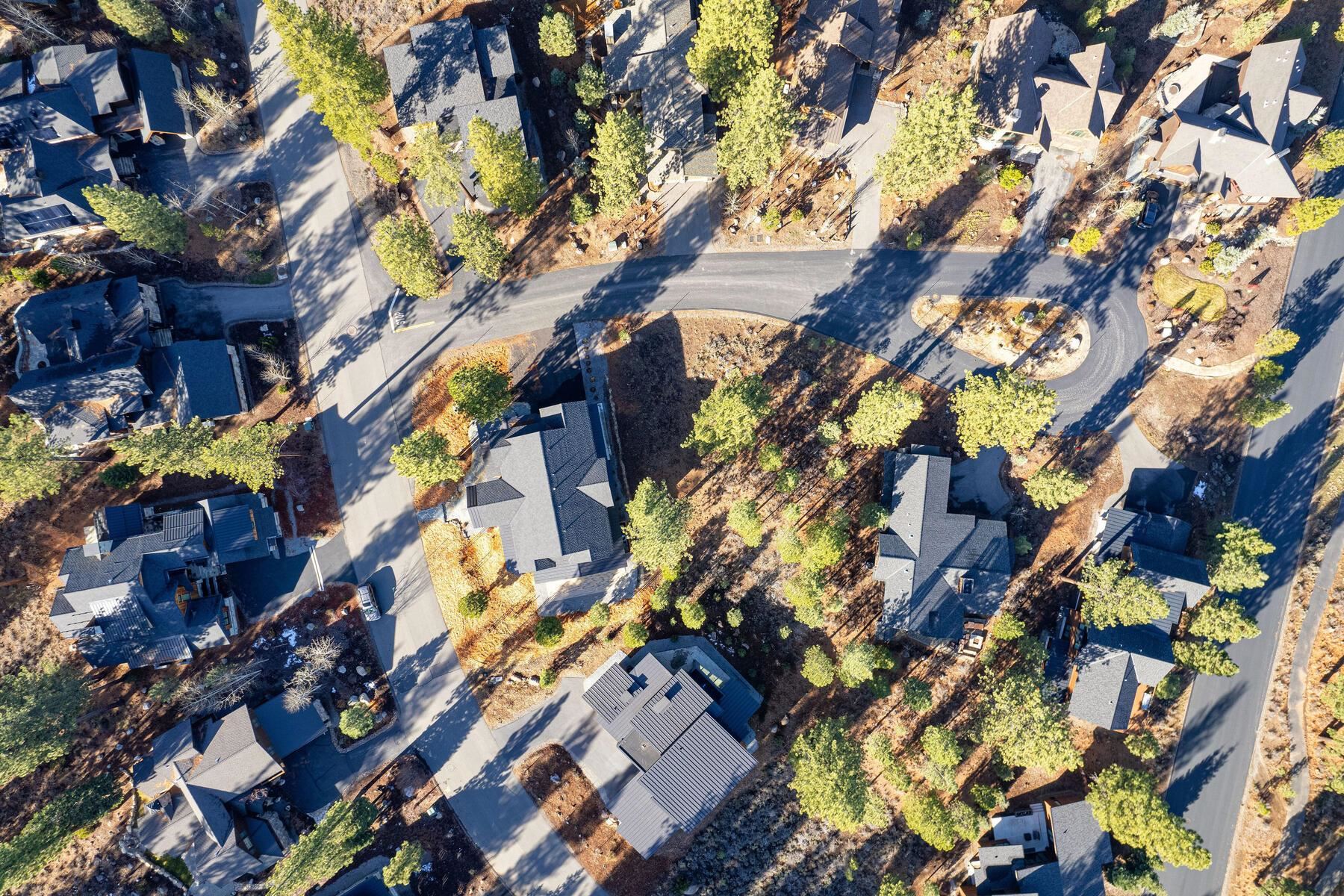 10020 Chaparral Court Truckee, CA 96161 - Photo 19 of 23 a backyard of a building with lots of trees