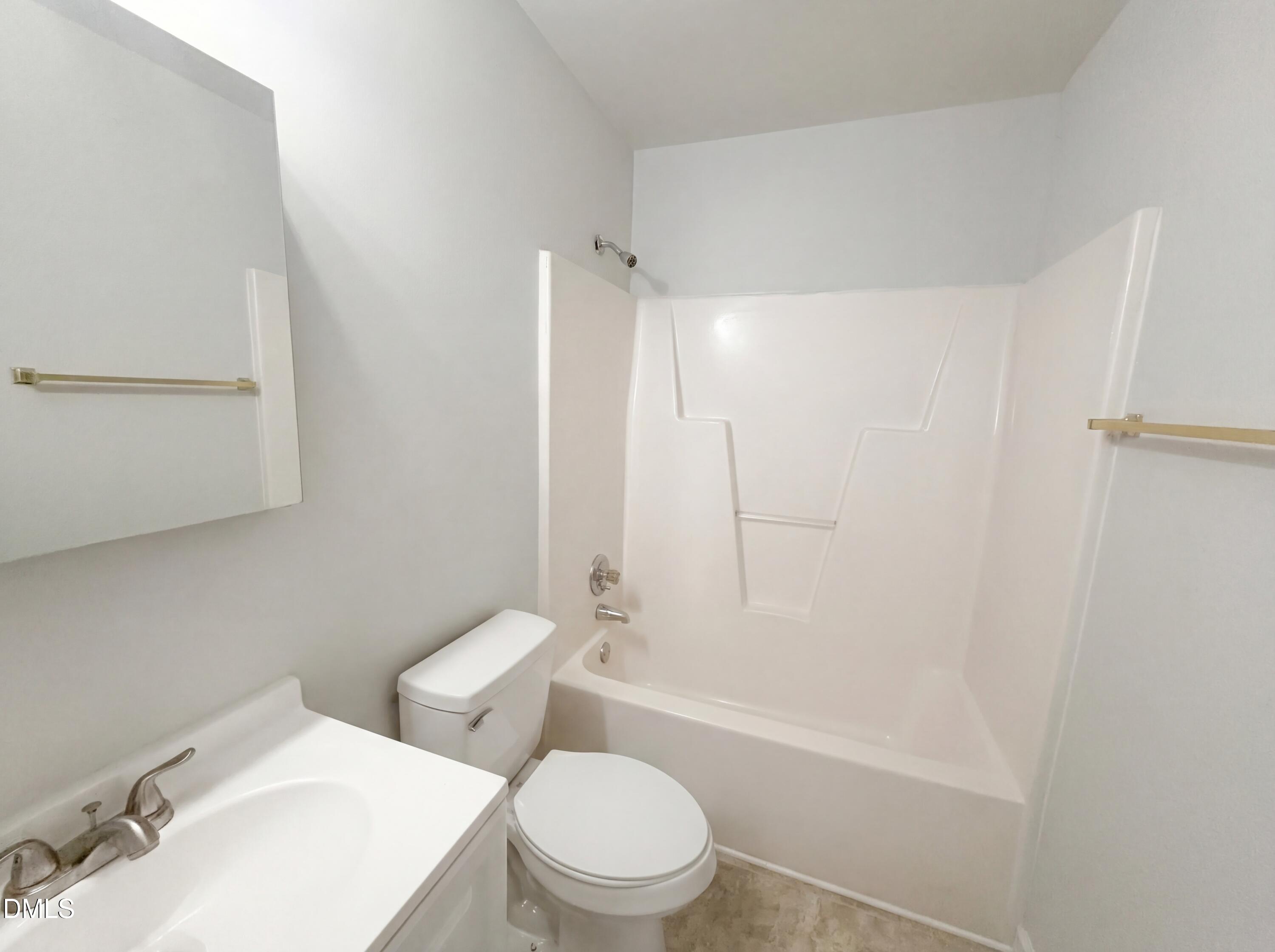 299 Greenleaf Road Angier, NC 27501 - Photo 12 of 15 a white toilet sitting next to a bath tub