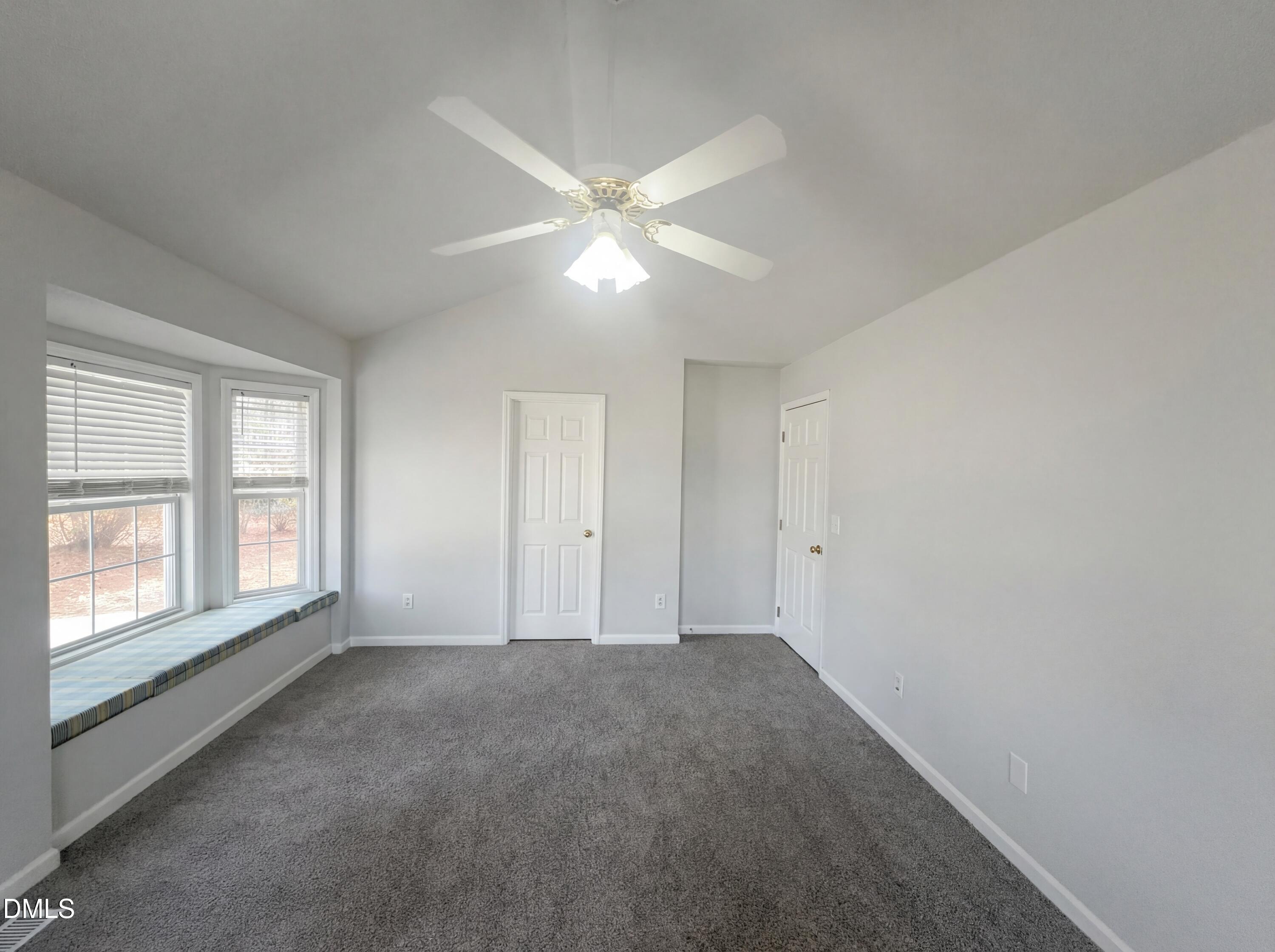 299 Greenleaf Road Angier, NC 27501 - Photo 4 of 15 a view of an empty room with a window