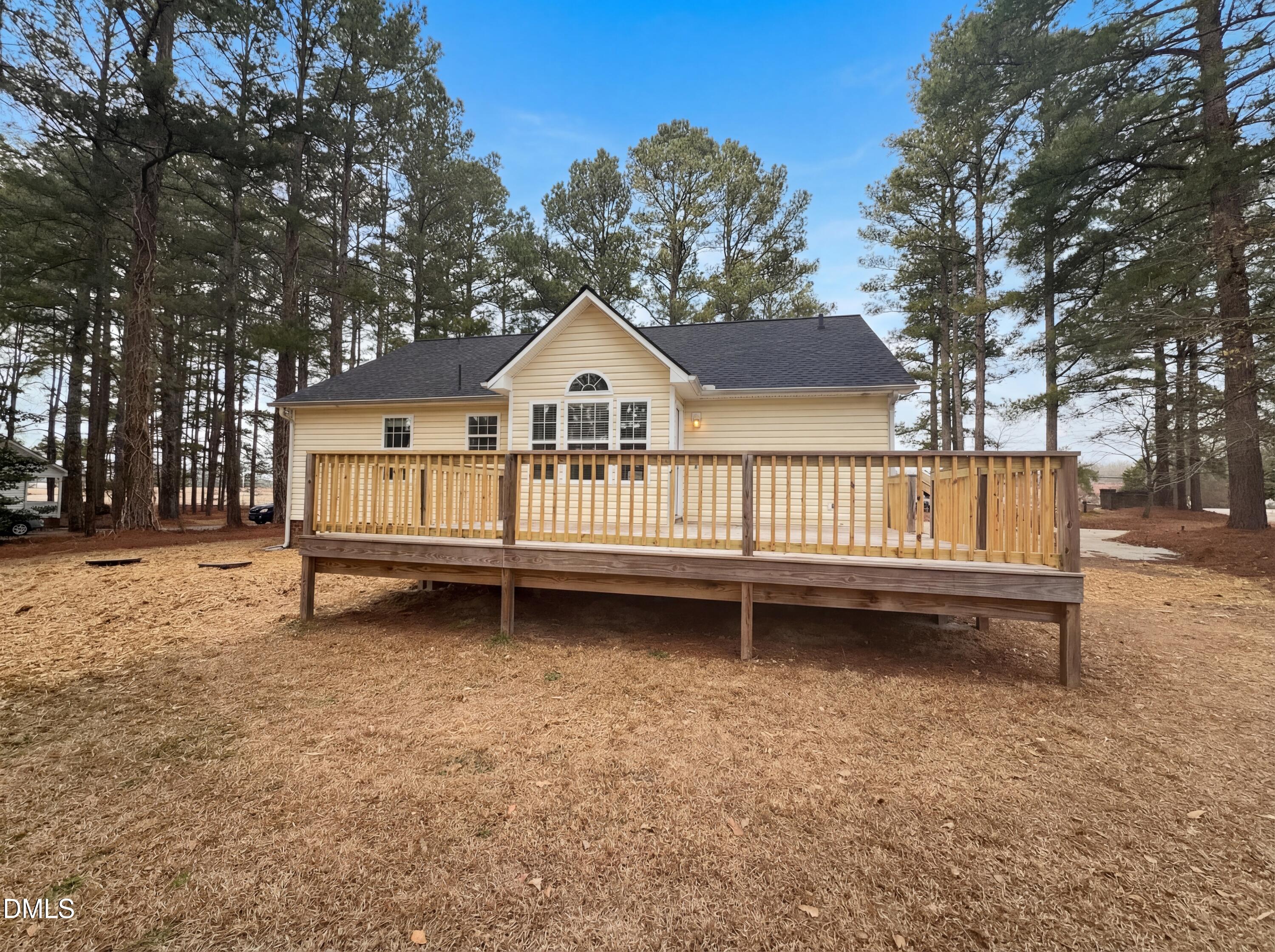 299 Greenleaf Road Angier, NC 27501 - Photo 5 of 15 a view of a house with a yard and sitting area