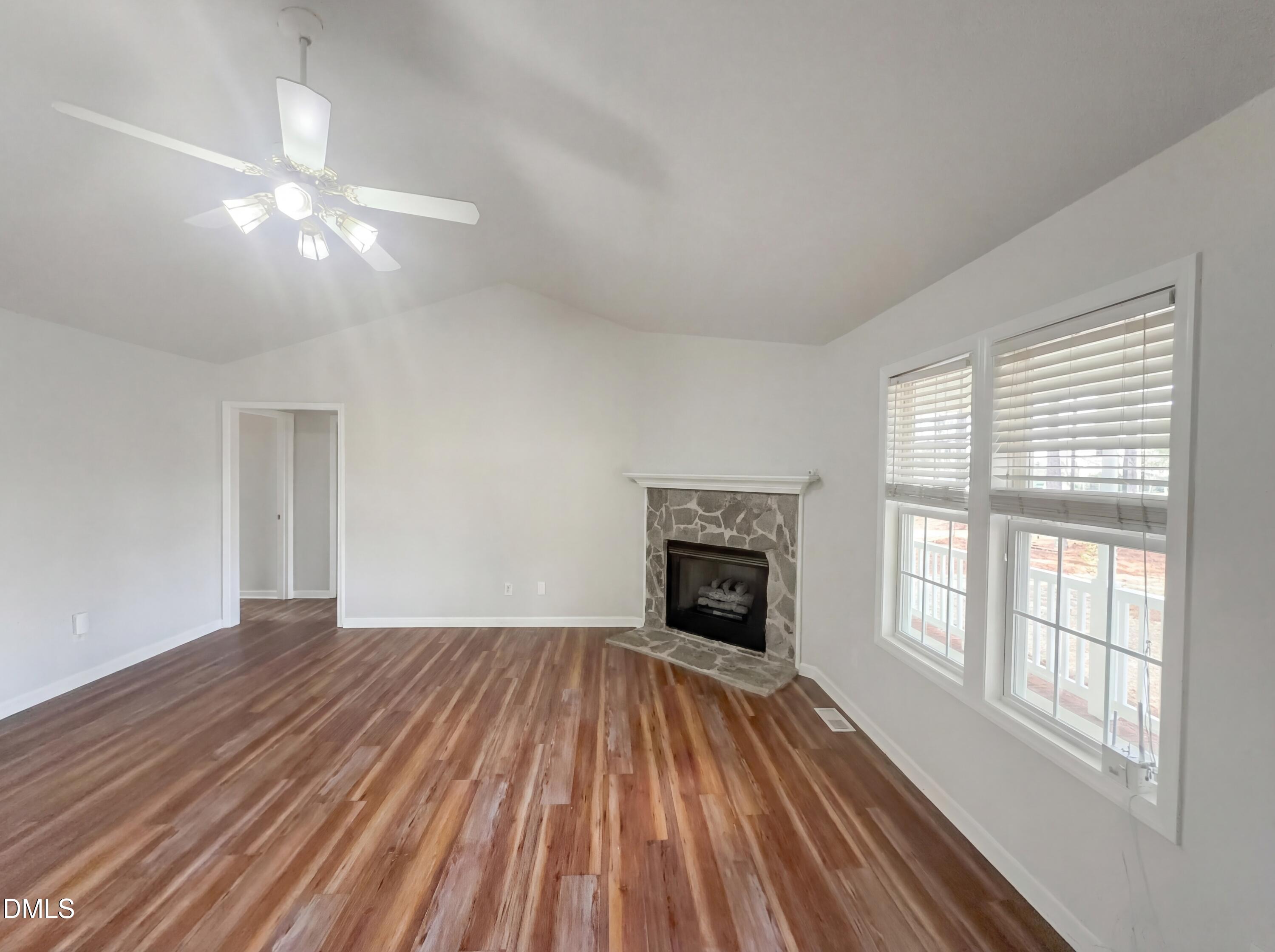 299 Greenleaf Road Angier, NC 27501 - Photo 6 of 15 a view of empty room with wooden floor and fan